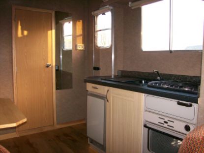 horsebox living area - with cooking, sink and fridge