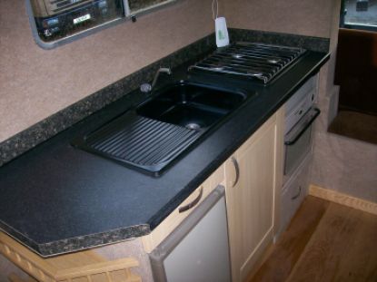 horsebox living area - with undercounter fridge, cooker and kitchen sink